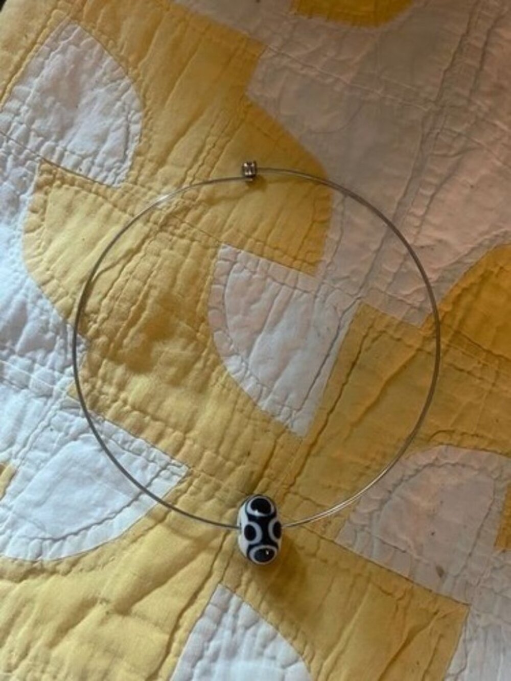 SS NECK WIRE WITH BLACK & WHITE GLASS BEAD, FROM PARIS - NEVER WORN